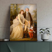Load image into Gallery viewer, Portrait of a couple dressed in golden regal attires standing near a dog with a human body standing on a green table near a flowerpot
