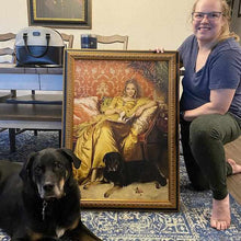 Load image into Gallery viewer, A girl holding a portrait of herself dressed in a golden royal robe sitting beside her dog

