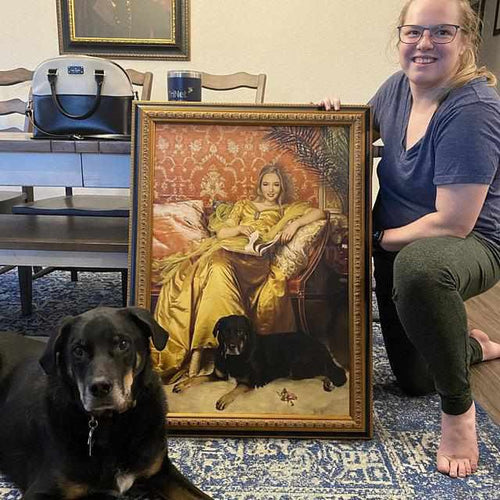 A girl holding a portrait of herself dressed in a golden royal robe sitting beside her dog