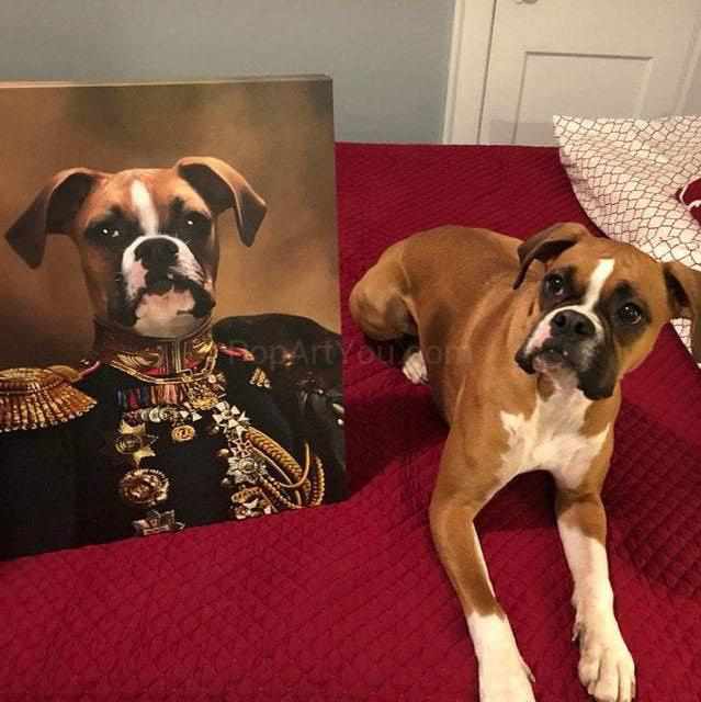 The dog lies near his portrait, in which his head is depicted on the human body