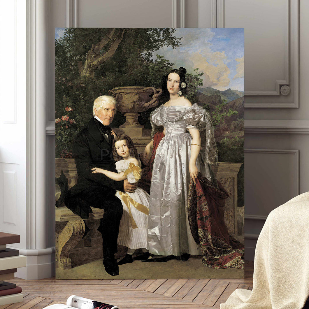 Portrait of a family dressed in historical royal clothes stands on a wooden floor next to a white wall